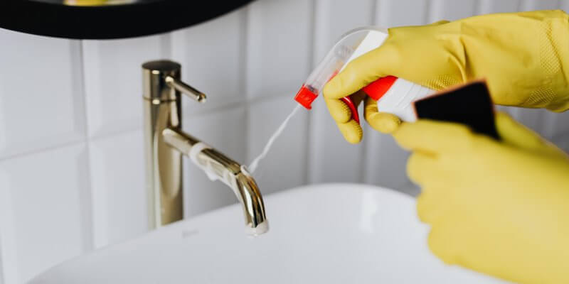 Cleaning with rubber gloves.