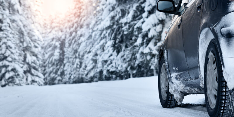 Rubber tires grips snow covered road