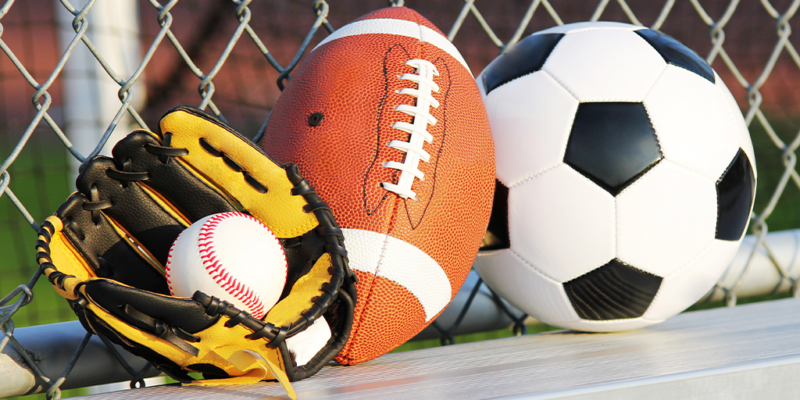 baseball inside glove, football, and soccer ball